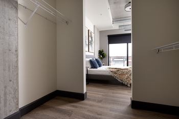 A room with a bed and a window.